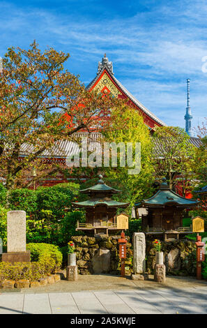Tradition and Modernity in Japan. Asakusa old temple and shrines below modern Skytree Tower in Tokyo. Stock Photo