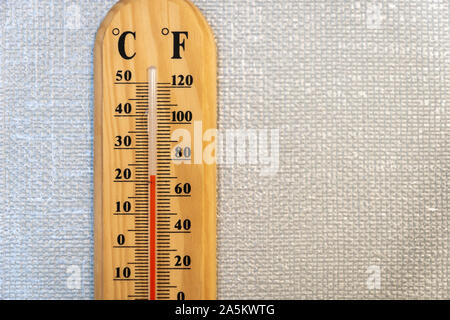 temperature gauge / thermometer on the white wall - analog temperature gauge  close up Stock Photo - Alamy