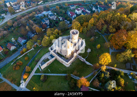 Medieval gothic castle in Bedzin, Upper Silesia, Poland. Aerial view from above in fall in sunrise light Stock Photo