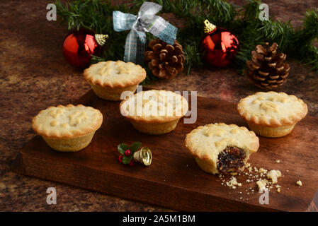wood platter of christmas mincemeat pies Stock Photo