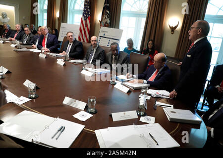 Director of the National Economic Council Larry Kudlow talks to United States President Donald J. Trump during a Cabinet Meeting at the White House in Washington, DCon October 21, 2019. Pictured from left to right: US Secretary of Education Betsy DeVos, US Secretary of the Interior David Bernhardt, Administrator of the US Environmental Protection Agency Andrew Wheeler, US Secretary of Health and Human Services (HHS) Alex Azar, The President, US Secretary of State Mike Pompeo, US Secretary of Labor Eugene Scalia, US Secretary of Housing and Urban Development (HUD) Ben Carson, US Secretary of Co Stock Photo