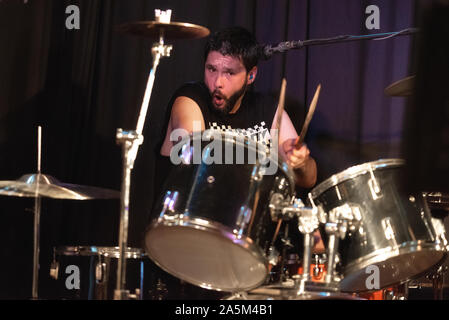 Male Musician Playing Drums And Cymbals At Concert . Stock Photo
