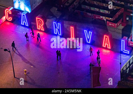 Neon sign marking the entrance to the annual winter carnival at the AIA Vitality Park in the Central District of Hong Kong. Stock Photo