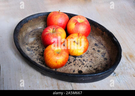 Five apples on a ceramic dish - John Gollop Stock Photo
