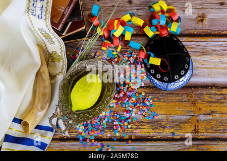 Jewish ritual festival of Sukkot in the jewish religious symbol Etrog, lulav, hadas arava kippah and shofar tallit praying book Stock Photo