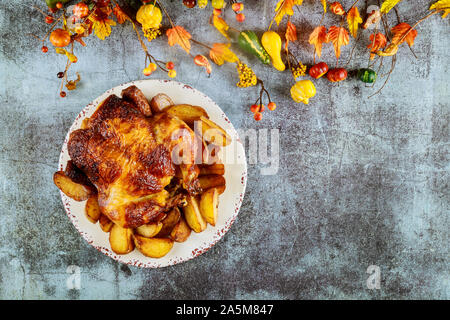 Baked whole fried chicken with mushrooms close-up on a table. vertical top view from above Stock Photo