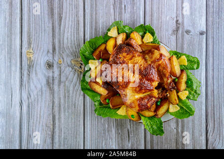 Thanksgiving day dinner table setting with whole roasted chicken Stock Photo