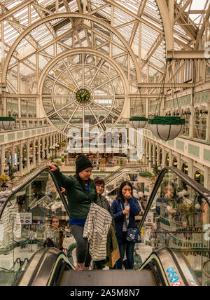 Female shoppers ascending escalator, St Stephen's Shopping Centre, Dublin, Ireland, UK Stock Photo