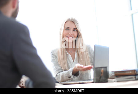 smiling businesswoman explaining something to her colleague Stock Photo