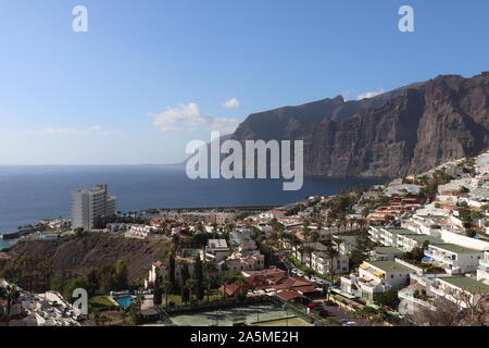 Cliffs towering over the town of Los Gigantes Stock Photo