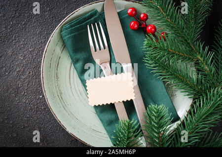 Festive table setting. Winter table set for Christmas or New Year dinner. Stock Photo