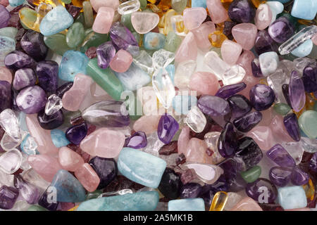 Healing Chakra Crystals Banner. Chakra colored tumbled healing stones. Stock Photo