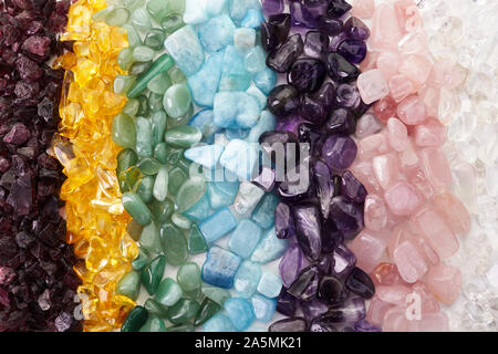 Healing Chakra Crystals Banner. Chakra colored tumbled healing stones. Stock Photo