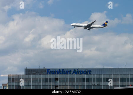 Frankfurt am Main, Hesse / Germany - September 11, 2019: An airplane from the airline Lufthansa is flying over the Frankfurt Airport sign Stock Photo