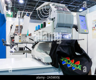 BUDAPEST/HUNGARY - OCTOBER 18, 2019: Technology trade show. An intelligent industrial embroidery machine on display. Stock Photo