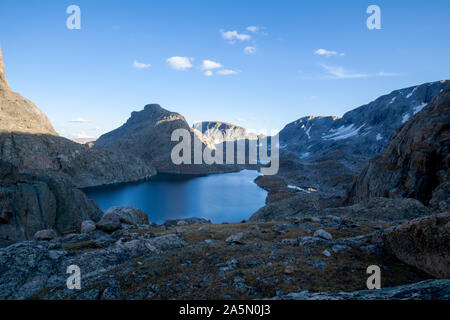 An evening shot of Lake 10988 with the mountain known as 'The Fortress' in the background. Located in the Alpine Lakes Basin. Wind River Range, WY. Stock Photo