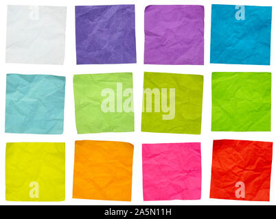 a set of colorful, crumpled sticky reminder notes isolated on white, office communication concept Stock Photo