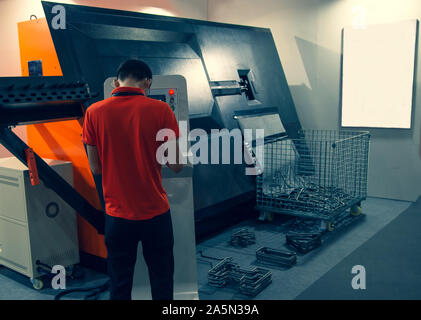 Worker operating steel wire bar bending machine Stock Photo