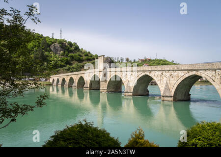 VISEGRAD, BOSNIA AND HERZEGOVINA - MAY 6, 2015: Mehmed Pasa Sokolovic bridge in spring. Also called Drina bridge, or Most na Drini, it is a medieval o Stock Photo