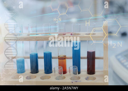 Female Research Scientist Uses Micropipette Filling Test Tubes in a Big Modern Laboratory. Stock Photo