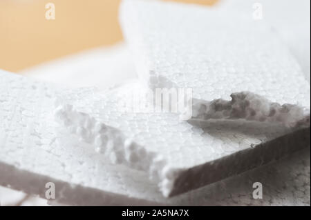 Closeup white polystyrene foam on corrugated paper. Polystyrene foam is  cushioning material in packaging, material for craft applications and other  Stock Photo - Alamy