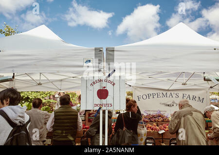 Boston, Massachusetts - October 3rd, 2019: People shopping for fresh produce and local goods at a farmers market in Copley Square on a Fall day. Stock Photo