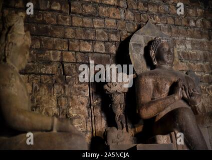 The statue of Dhyani Buddha Vairocana (right) inside Mendut Temple in Central Java, Indonesia. Stock Photo