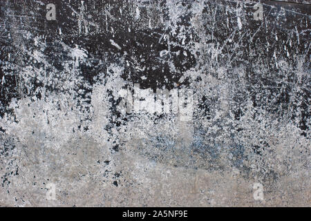 Abstract grunge background. Old rusty metal with corrosion, scratches and scuffs. The paint color is black and white. Stock Photo