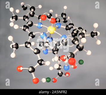 Molecule model of the Heme B molecule, a part of the hemoglobin complex. White is Hydrogen, black is Carbon, red is  Oxygen, yellow Iron and green mar Stock Photo