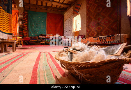 Traditional  wool carding tool for moroccan carpets.  Ait Benhaddou Ksar, a World Heritage Site, Morocco Stock Photo