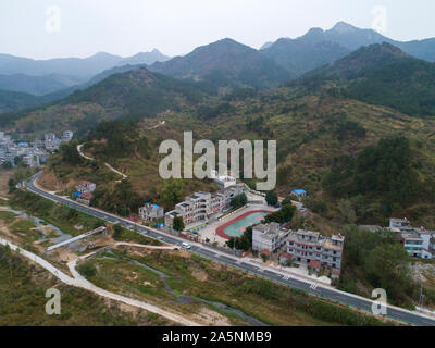 (191022) -- LUOTIAN, Oct. 22, 2019 (Xinhua) -- Aerial photo taken on Oct. 11, 2019 shows Hope primary school in Luotian County, central China's Hubei Province. Fang Rong, 29, is the headmaster of Hope primary school of Luotian County, her alma mater. Born in a poverty-stricken region, Fang Rong was a left-behind girl. Thanks to the Hope Project and people's aids, she succeeded in graduating from a secondary normal school. To help more children and repay people's kindness, she decided to be a teacher at her alma mater. In spite of the austere way of life, Fang shouldered her responsibility Stock Photo