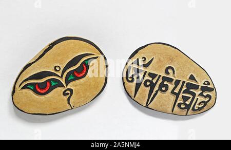 Mani stones, Tibetan, rdo ma ni, Om mani padme hum in Tibetan script, souvenirs from Tibet Stock Photo