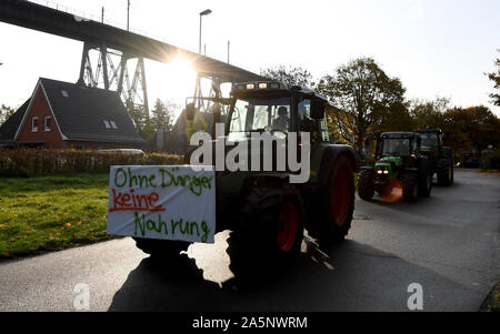 Rendsburg, Germany. 22nd Oct, 2019. Demonstrating farmers come with tractors to the meeting point of a rally. Nationwide, farmers are protesting against the federal government's agricultural policy with rallies. Credit: Carsten Rehder/dpa/Alamy Live News Stock Photo