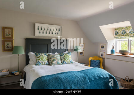 Cushions and blinds in Bella Aqua by Manuel Canovas for Colefax & Fowler. Stock Photo
