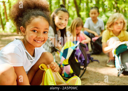 African girl and friends take a rest on the tour Stock Photo