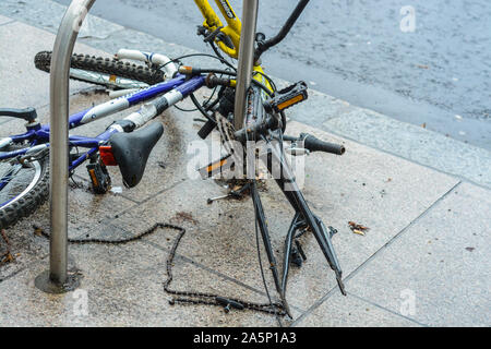 Broken bicycle on the street after thief stolen the elements he needed. This is a very common problem in London Stock Photo