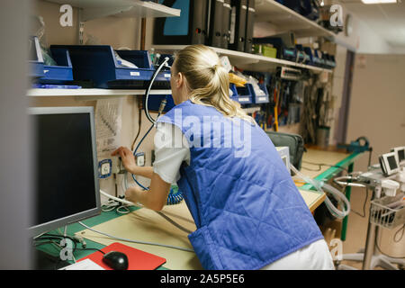 Female engineer checking hospital equipment Stock Photo