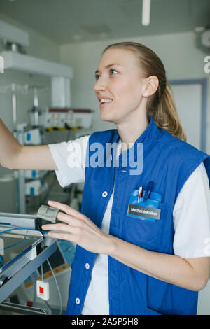 Female engineer checking hospital equipment Stock Photo