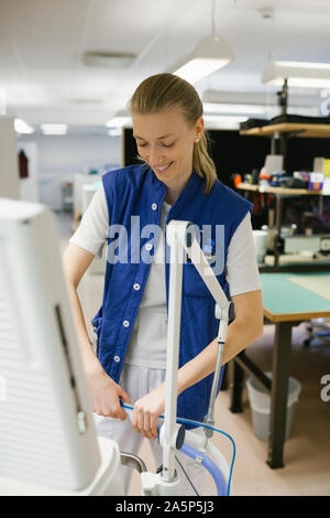 Female engineer checking hospital equipment Stock Photo