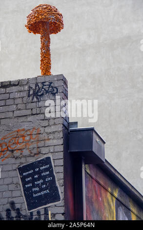 Mushroom or toadstool sculpture  on a brick wall in Hosier Lane Melbourne Victoria Australia. Stock Photo