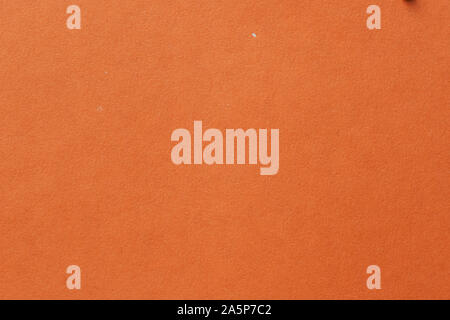 Yellow color cardboard. Clean orange paper texture. a high resolution photo. Empty orange backgrounds. Stock Photo