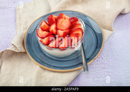 Strawberry Custard, Pudding with strawberry over wooden background. Stock Photo