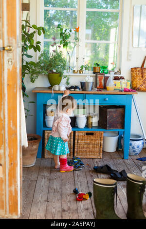 Toddler girl trying shoes Stock Photo