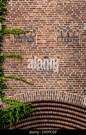 Brick wall with crowns Stock Photo