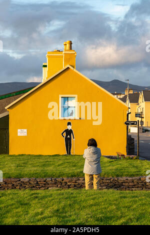 Yellow house with figure of Charlie Chaplin, Waterville, County Kerry, Ireland Stock Photo