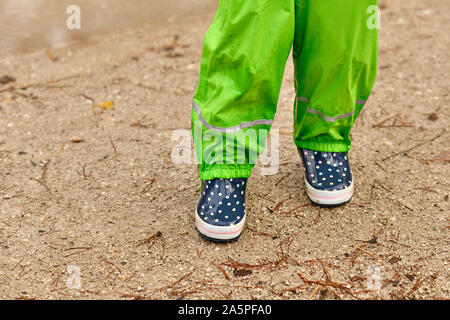child walking through the mud flat waterproof pants and rubber boots  Germany Lower Saxony Stock Photo Picture And Rights Managed Image Pic  BWIBS385656  agefotostock