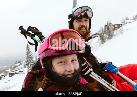 Skiers in mountains Stock Photo