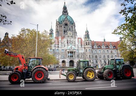 Hanover, Germany. 22nd Oct, 2019. Tractors are standing in front of the town hall. The rally is part of a nationwide campaign by the farmers' initiative 'Land schafft Verbindung', which has been joined by tens of thousands of farmers in a very short space of time. They are protesting against the federal government's agricultural policy. Credit: Sina Schuldt/dpa/Alamy Live News Stock Photo