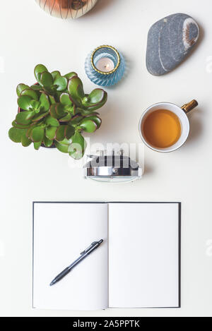 Empty work desk in home office with white wall and pencils and ...