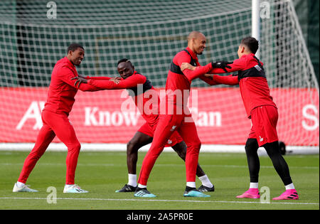 Liverpool's Georginio Wijnaldum (left to right), Sadio Mane, Fabinho and Roberto Firmino during a training session at Melwood Training Ground, Liverpool. Stock Photo